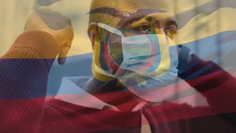 animation of flag of ecuador waving over man wearing face mask during covid 19 pandemic