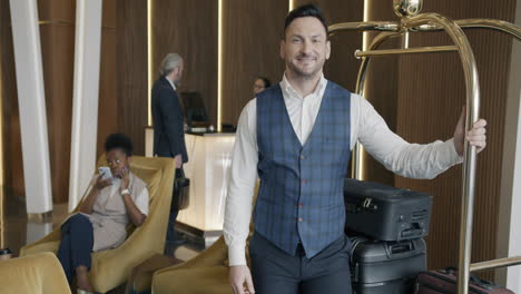 hotel lobby with bellhop and guests
