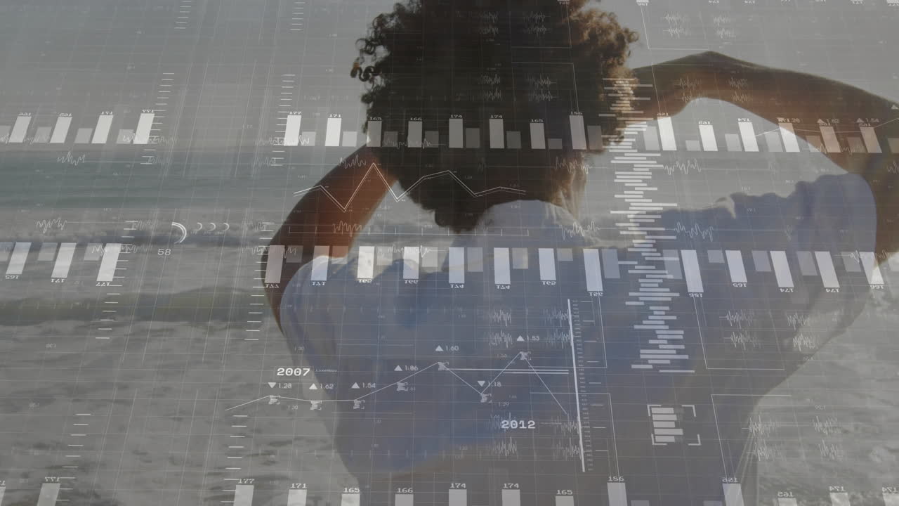 해변에 서 있는 사람 위에 애니메이션 금융 데이터 차트