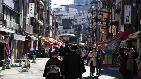 a cultural parade moves through a bustling city street.