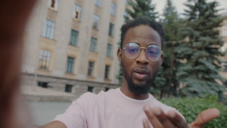 man taking selfie in city