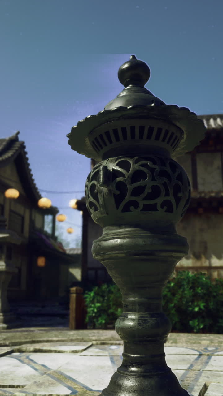 Decorative lanterns illuminate an ancient courtyard in a historic village