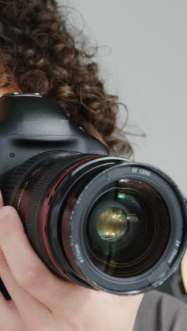 photographer taking photo with professional digital camera