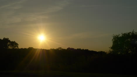 a gorgeous sunset in the texas hill country that silhouettes the hills in front of it