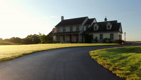entering driveway front entrance of large secluded home