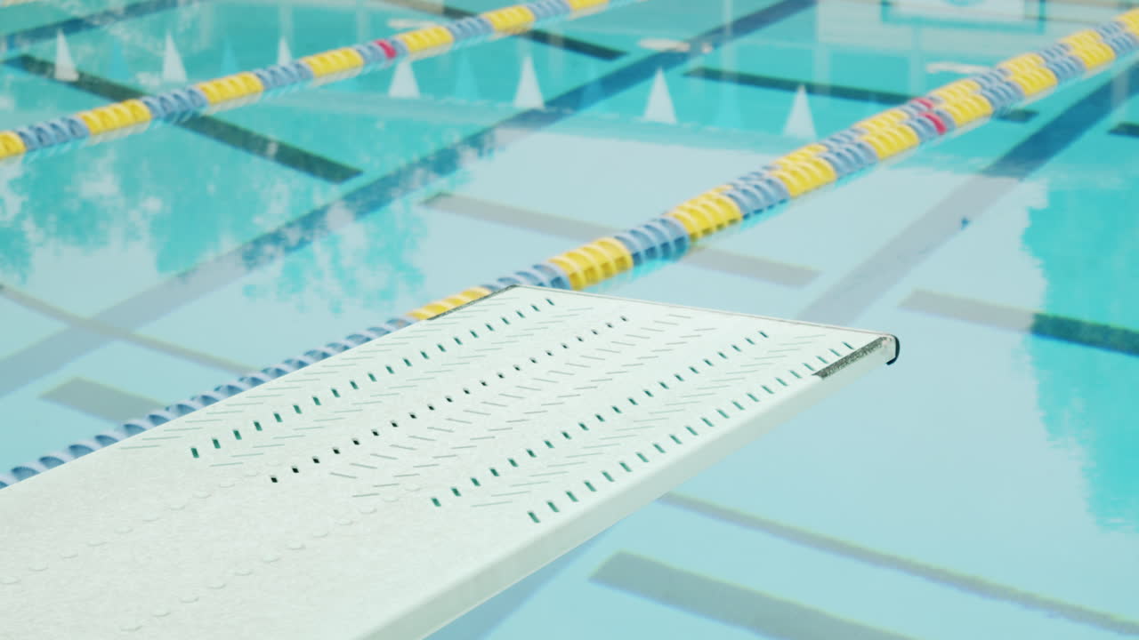 Diving board over a swimming pool