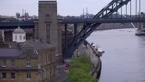 zoomed in shot of the epic strucuture of the tyne bridge in newcastle upon tyne showing the busy traffic and nesting sea birds