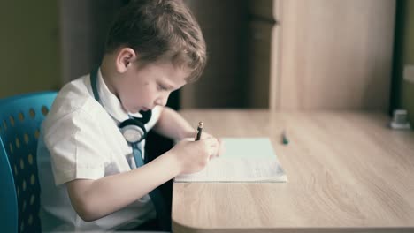 child sit in headphones and do school homework