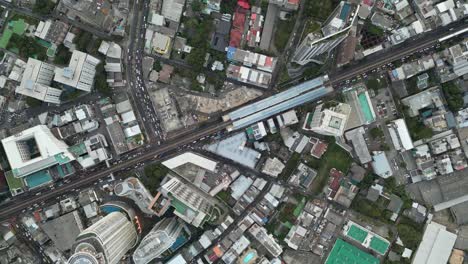 aerial view of a dense city with train station
