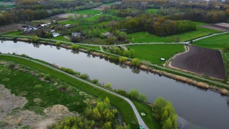 Overflowed-Coast-of-River-Scheldt-in-Belgium,-Aerial-Fly-Away-View