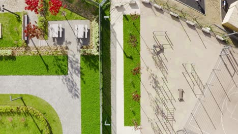 urban park aerial view with fitness area and picnic tables