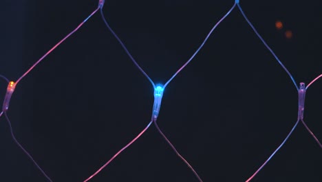 close-up view of a diamond-patterned, lighted wire mesh