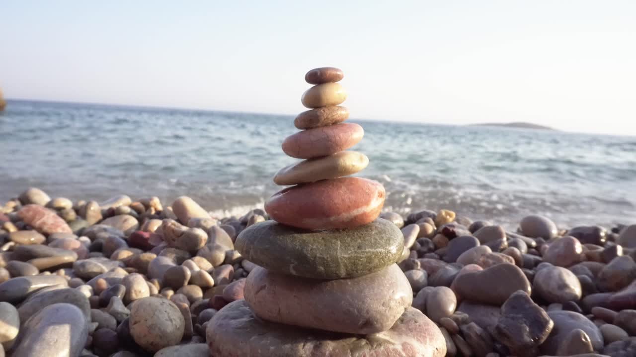 Stones in coast near sea on sunny day