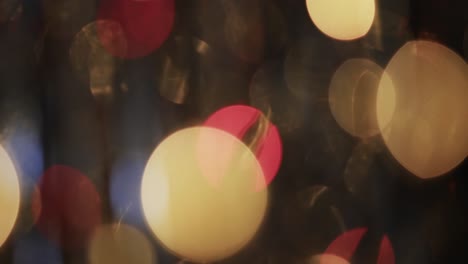 video of flickering multi coloured bokeh spots of light with copy space