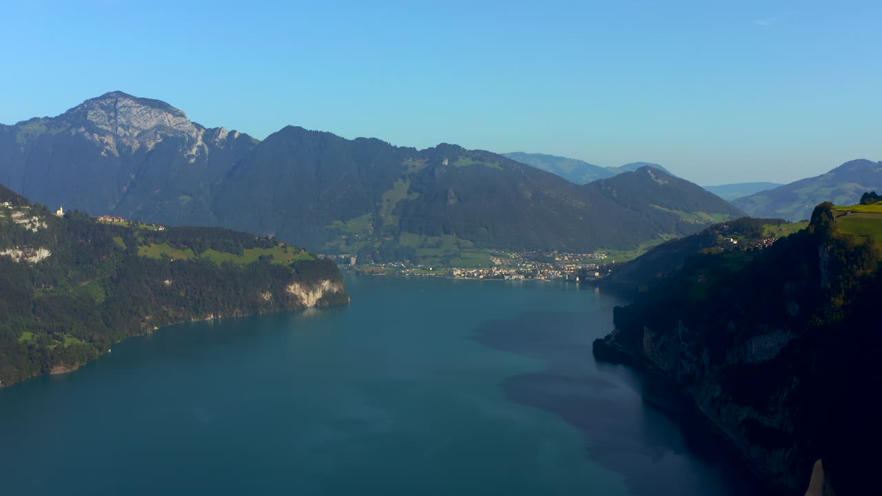 Stunning Aerial View of a Lake Surrounded by Mountains in Switzerland