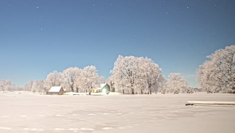 Time-lapse-shot-of-bright-night-with-stars-at-sky-lighting-on-snowy-field-in-north-Europe---changing-to-grey-sky-with-clouds-at-night---snowy-nature-scene