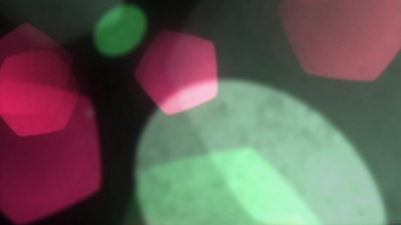 Abstract Background with Floating Pink and Green Bokeh Light Orbs
