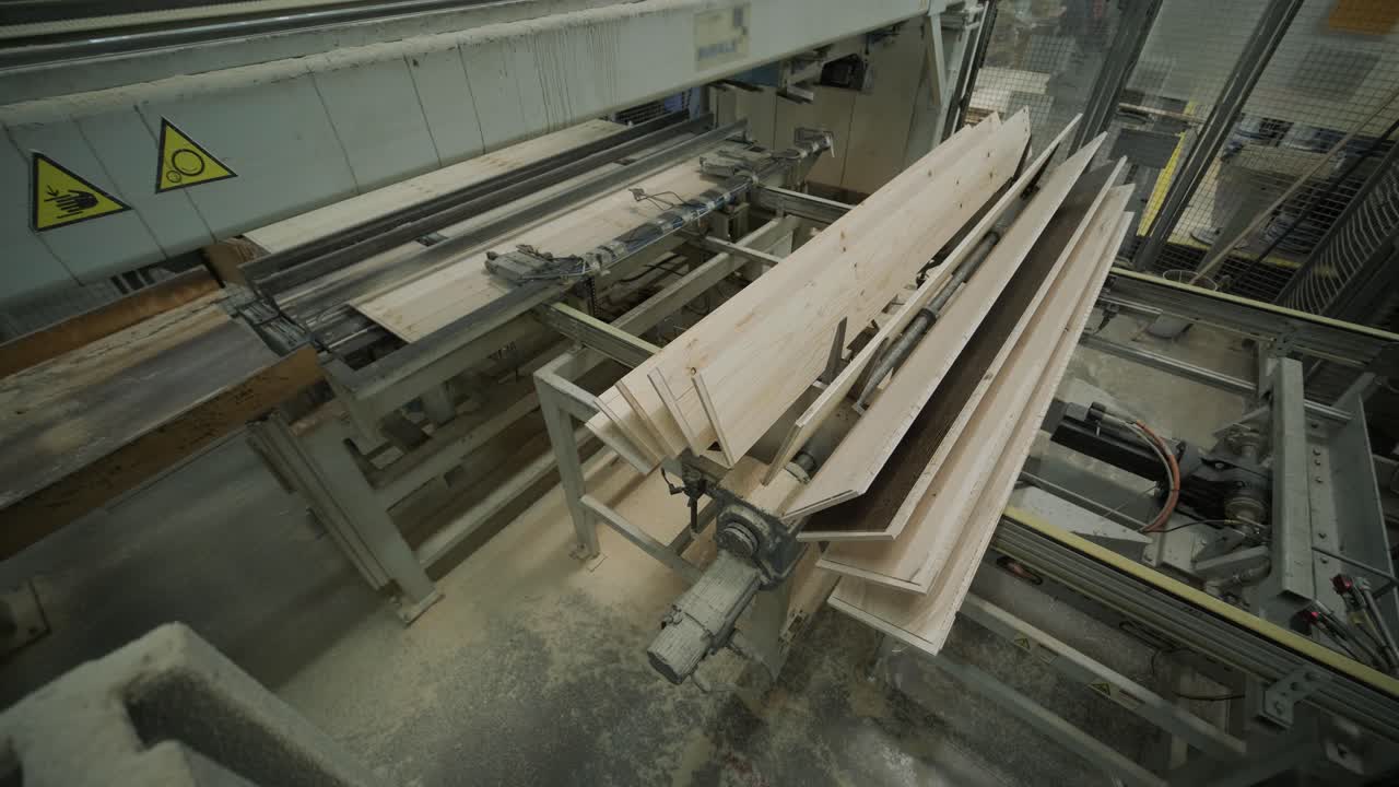 Automated Machine Processing and Stacking Wood Planks in a Factory
