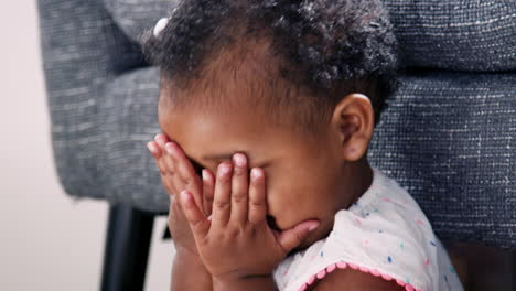 Cute-Baby-Girl-Playing-Peek-A-Boo-At-Home