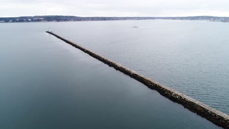 birds eye view of the stone bridgeway to the rockland breakwater lighthouse in maine