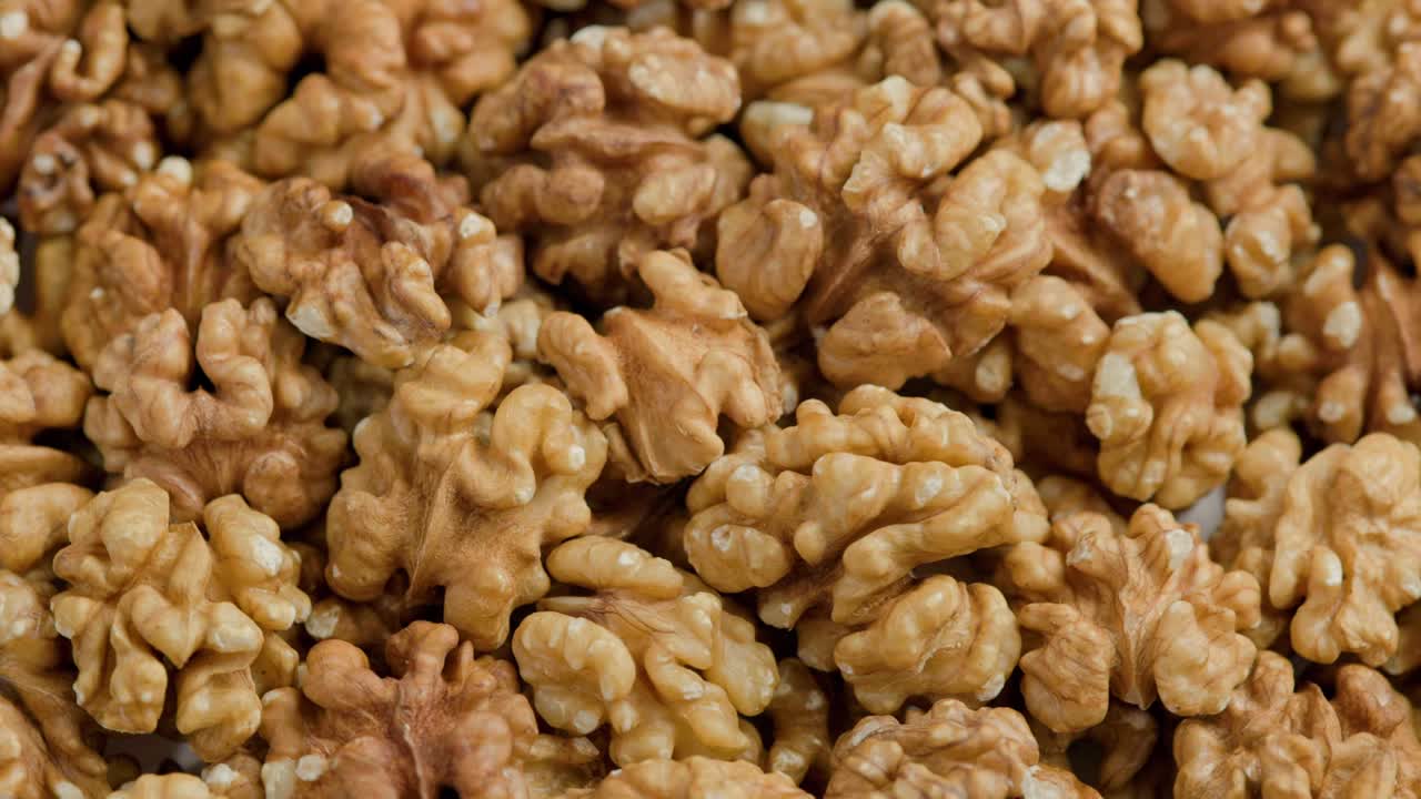 looped spinning walnuts without the shell close-up full frame background