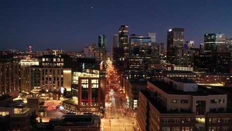 a descending pan of a busy denver street