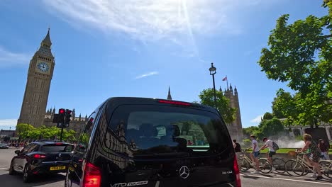 cyclists and vehicles near iconic london landmark