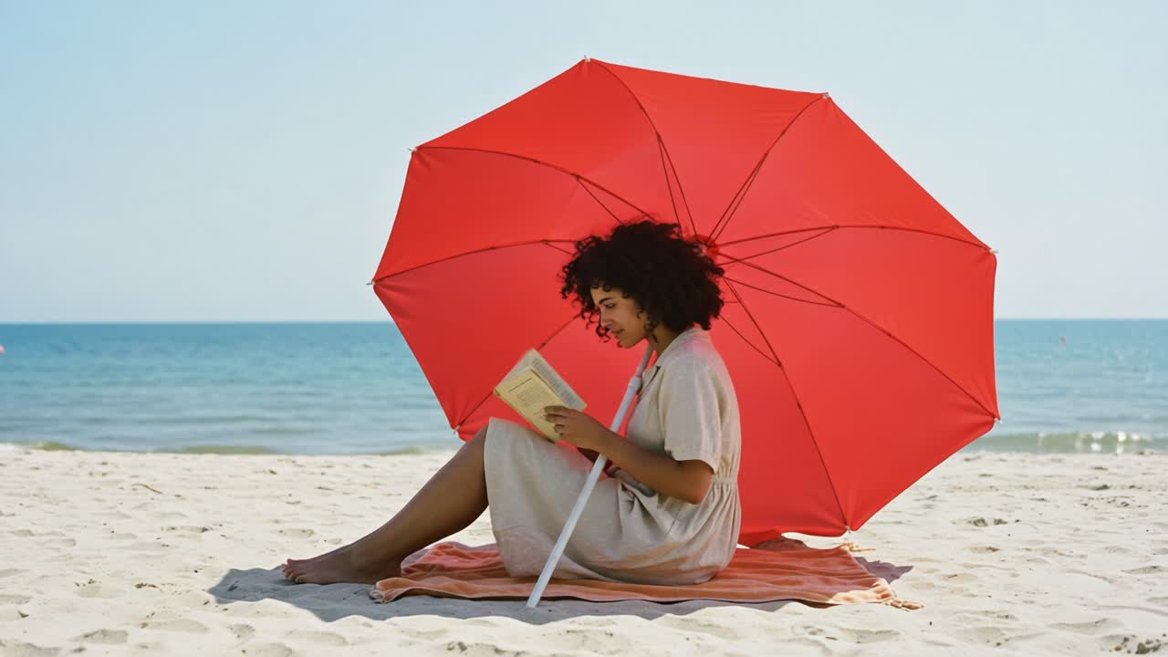 A serene beach scene featuring a young woman reading a book under a vibrant red umbrella, enjoying the tranquility of sun and sea while soaking in the delightful atmosphere
