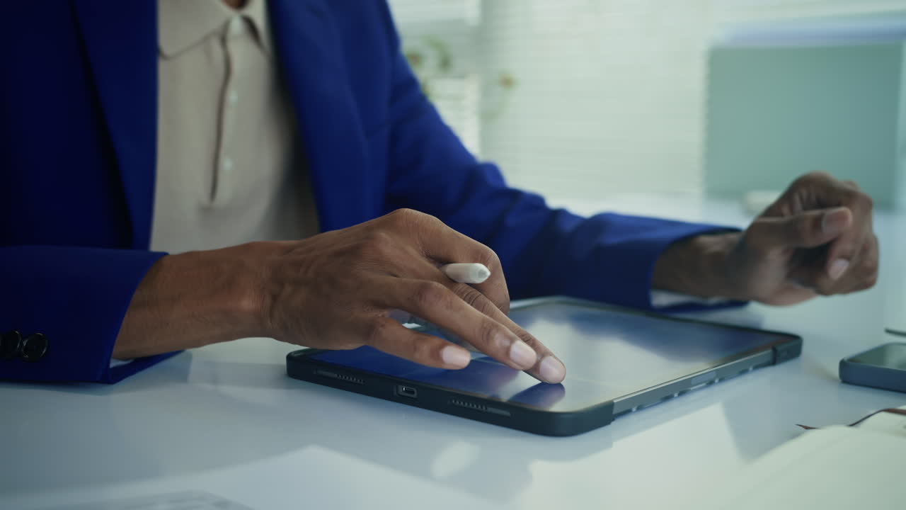 Hands of Analyst Checking Document on Tablet PC at Desk