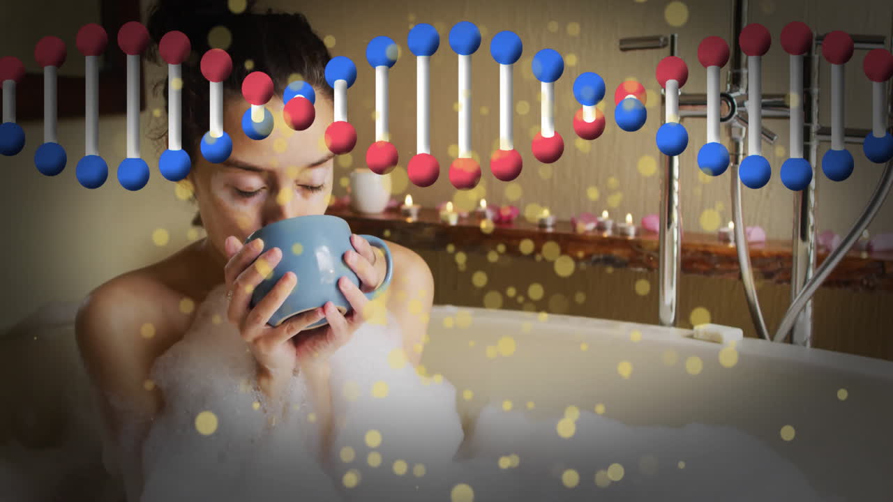 Woman sipping from blue mug in bubble bath, showing floating DNA helix health animation