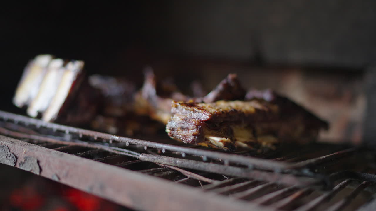 Grilling BBQ ribs in rustic oven, authentic latin american outdoor cooking