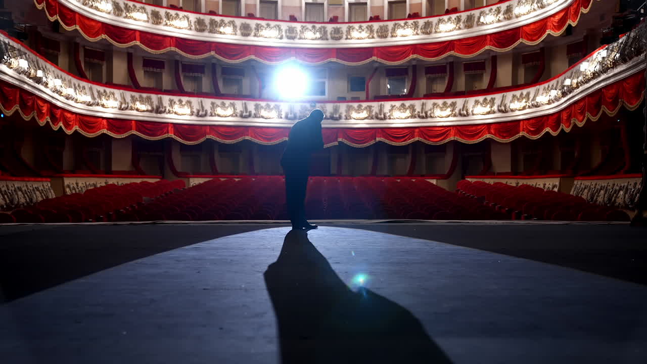 Empty raws in theater. Actor bows down in front of empty auditorium. Cancellation of mass events to prevent spread of coronavirus infection.
