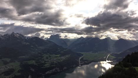 breathtaking aerial view of swiss alps mountains and lake