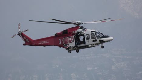 firefighting rescue helicopter flies over scene