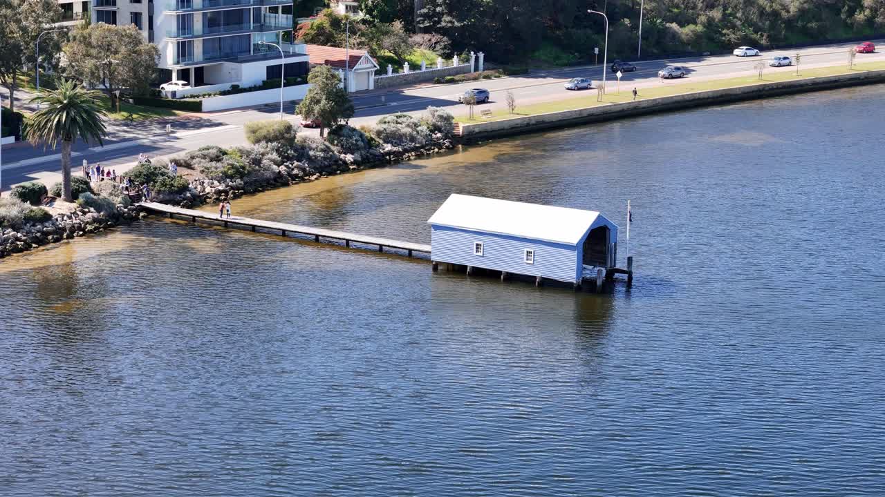Famous iconic blue boat house sitting along the banks of Perth's Swan River