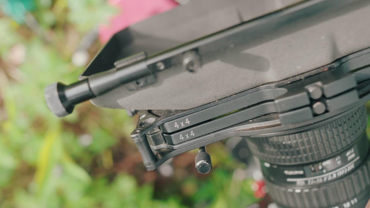 4x4 ND filter removed from matte box mounted to cinema lens, top angle closeup