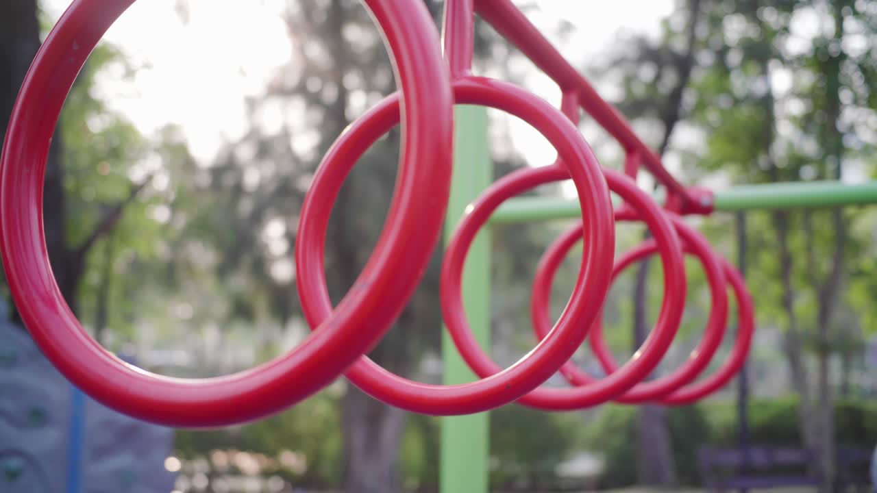 Red climbing roll bar in outdoor playground
