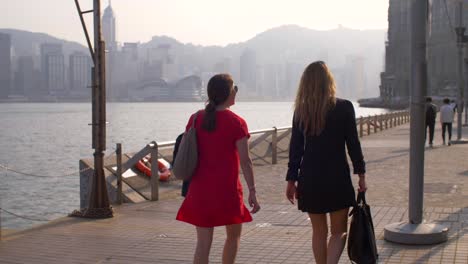 tracking behind two women in hong kong