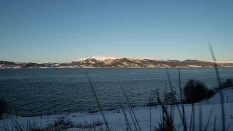 full-day timelapse in the fjord with mountain views at winter - dawn to night