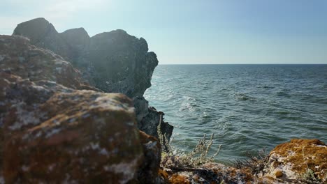 A-stunning-view-of-the-tranquil-Sea-of-Azov-from-rugged-coastal-rocks-in-Crimea,-showcasing-the-natural-beauty-and-peaceful-surroundings