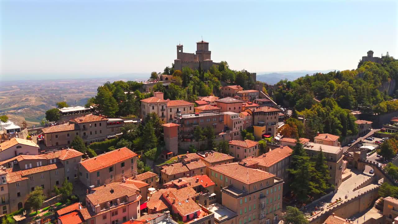 Soaring above San Marino, the drone showcases its iconic skyline, with majestic castles, winding streets, and lush greenery.