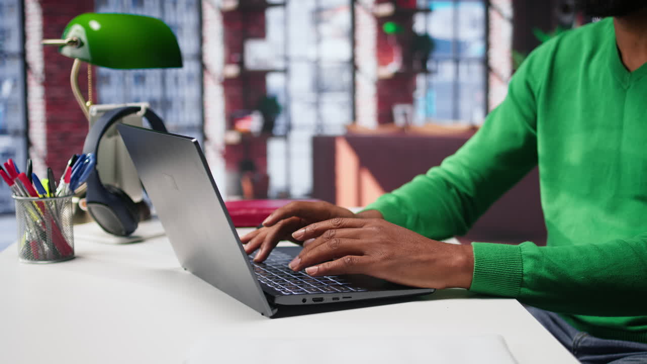 Vertical Video Freelancer creating articles content for his online blog at home desk