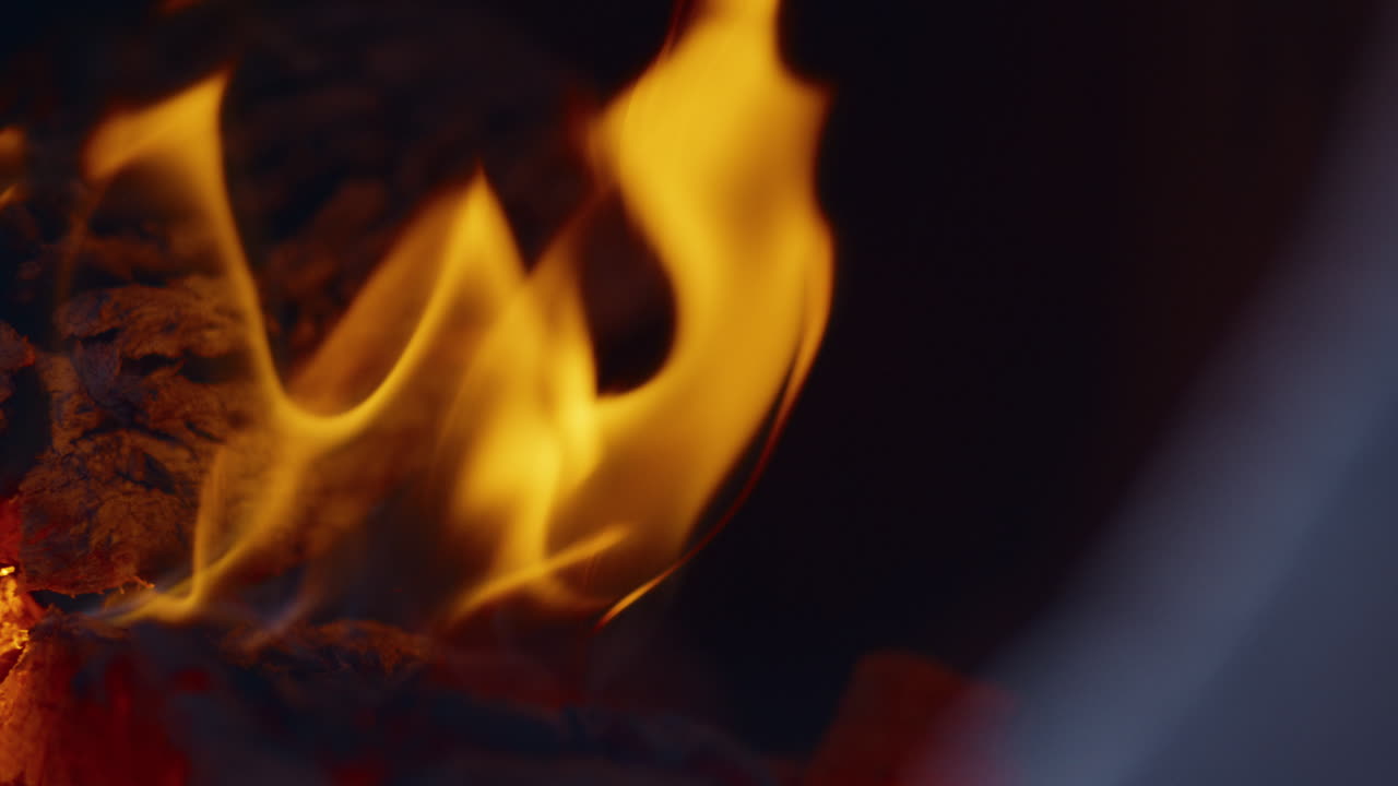 Slow motion fire in the fire box of a barbecue pit