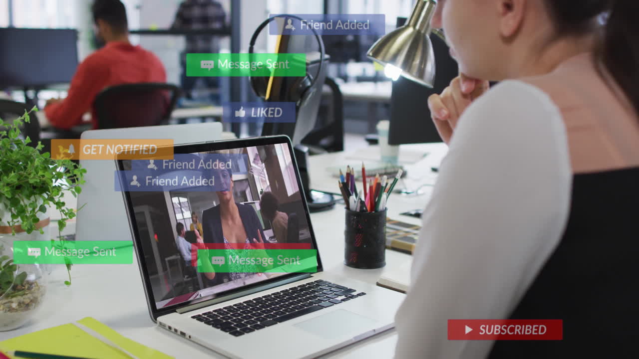 Watching animation on laptop, person in school receiving social media notifications