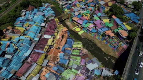 bird-eye-view-of-Jodipan-Village,-the-famous-and-touristic-Rainbow-village-in-the-city-of-Malang,-East-Java---Indonesia