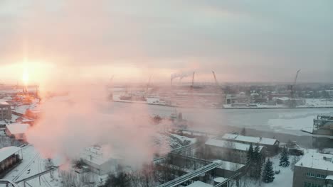 fly over aerial view of industrial port in winter, covered with show