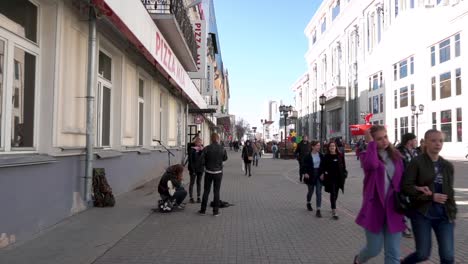 city street scene with musicians and pedestrians