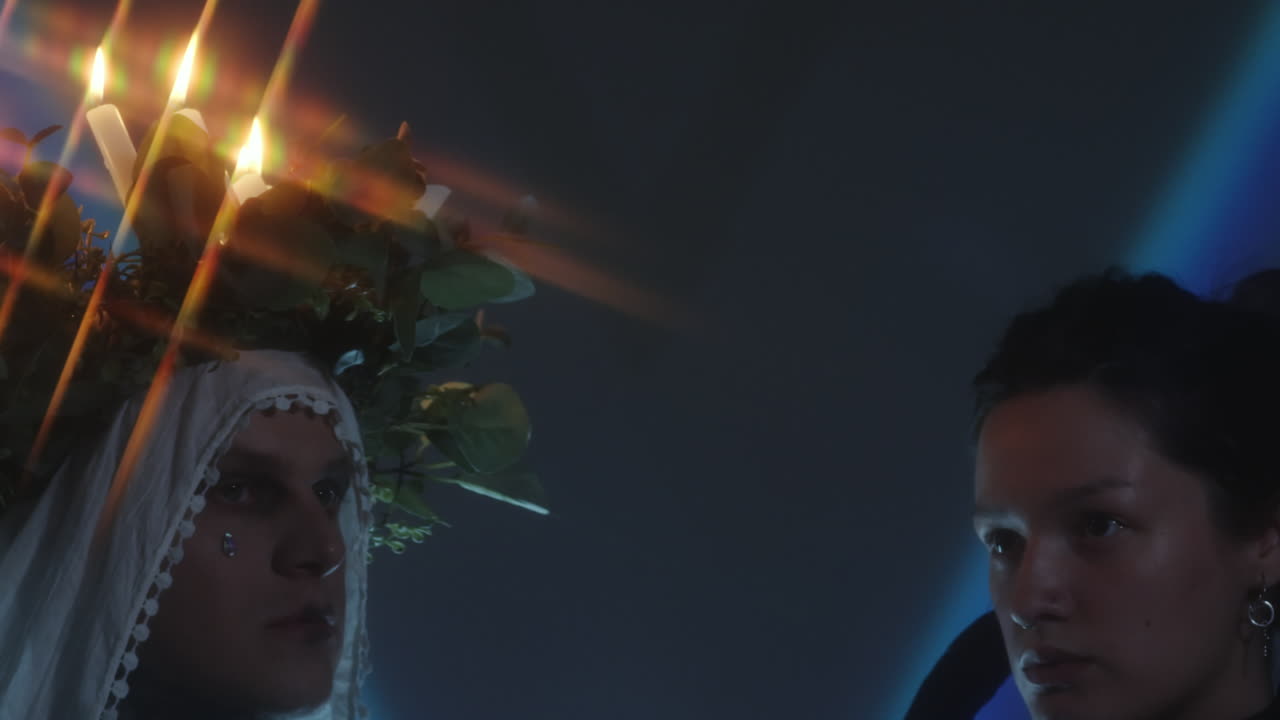 Festively Dressed Couple in Dark Studio