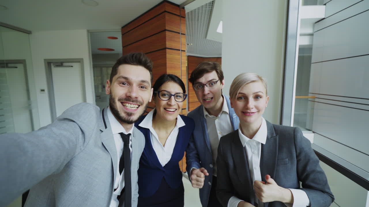 Business Team Selfie in Office Corridor