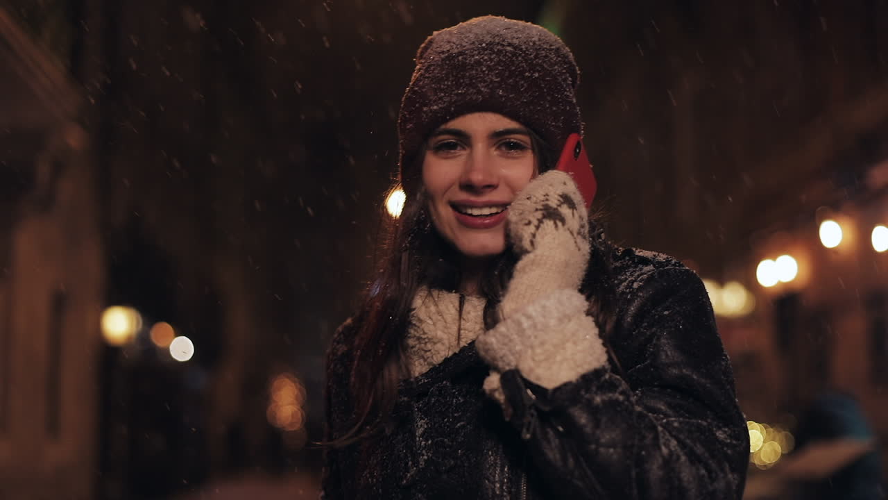 Woman on a phone call in the snow